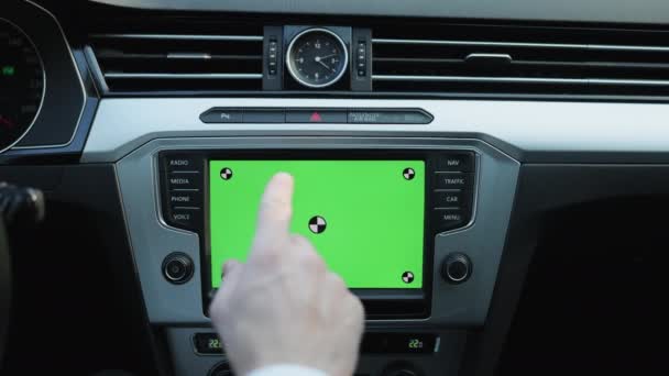 Shot for animation. Finger tapping greenscreen mock-up dashboard screen in modern car. Map application online. Businessman driving luxury car. Business people lifestyle. Weekend trip — Video