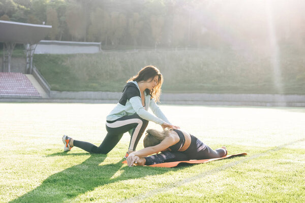 Physiotherapist expert checking of sportswoman physical treatment for rehabilitation. The doctor works on specific muscle groups or joints. Physiotherapy and recovery. Rehabilitation concept