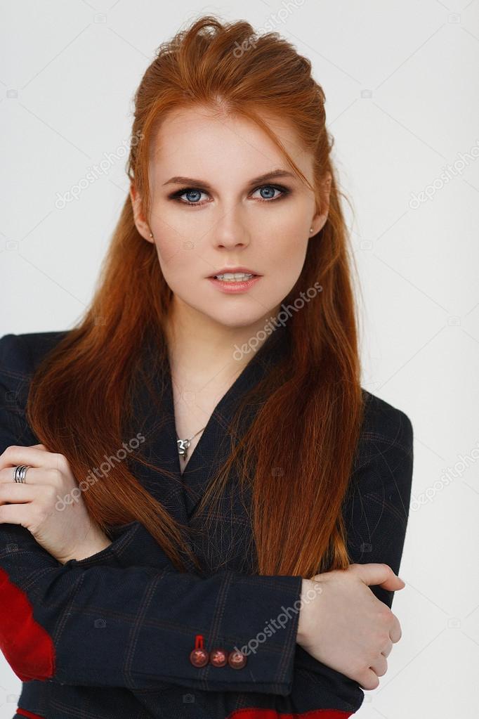 Portrait of a beautiful young woman with blue eyes and red hair. Stock  Photo by ©iyakunina21.yandex.ru 103437568