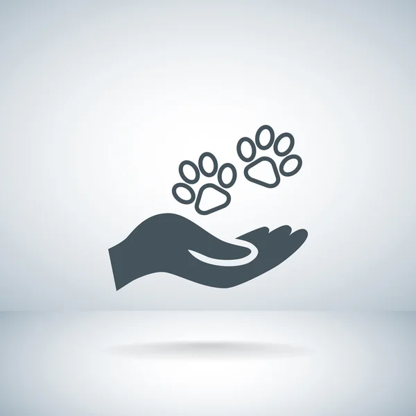 Hand holds paws symbol. — Stock Vector