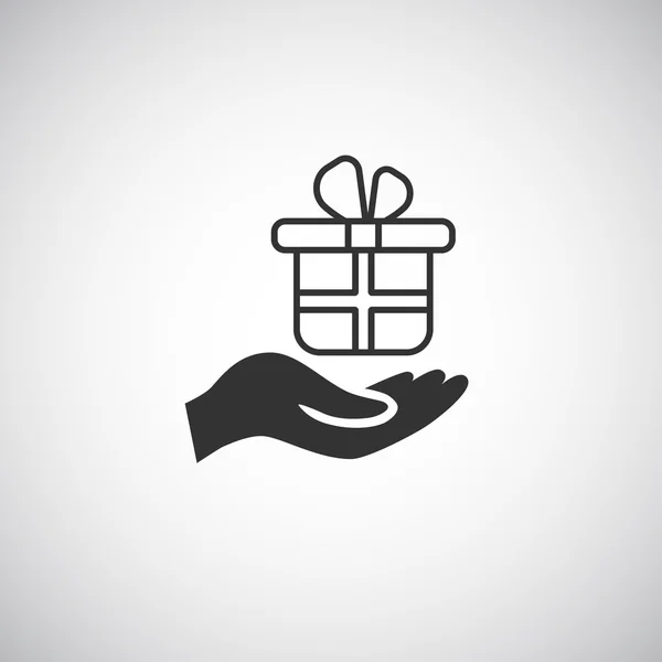 Hand holding gift box icon — Stock Vector