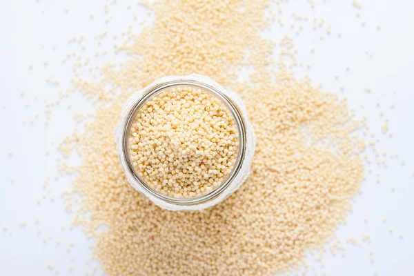 Millet in a glass jar.. — Stock Photo, Image
