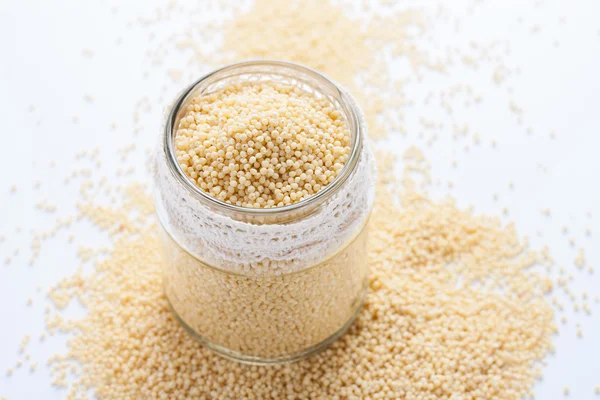Millet in a glass jar.. — Stock Photo, Image