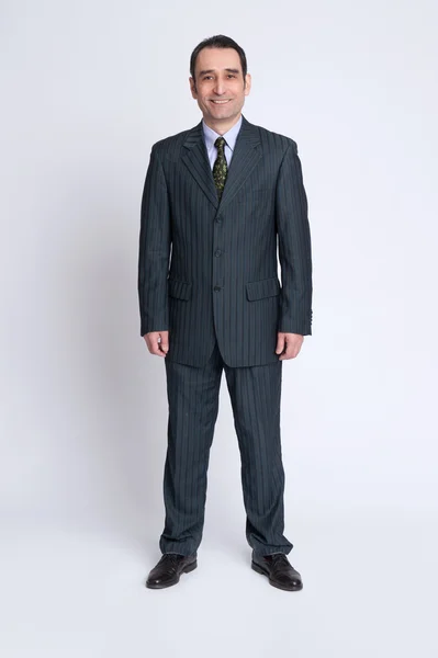 Uomo d'affari su sfondo grigio — Foto Stock