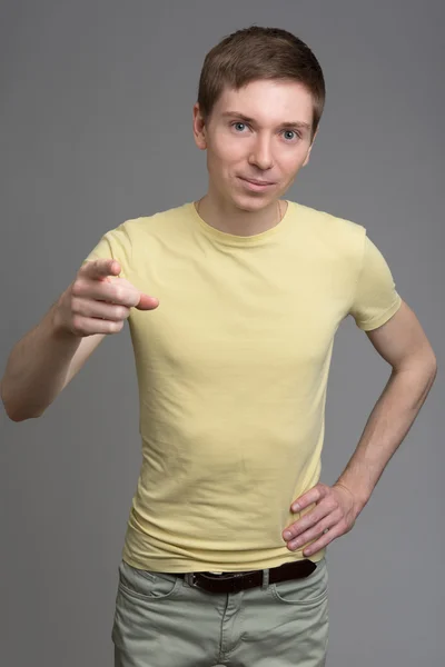 Young  man pointing towards the camera — Stock Photo, Image