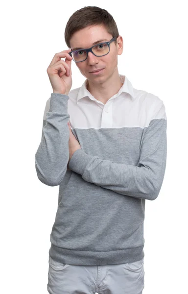 Junger Mann justiert seine Brille. — Stockfoto