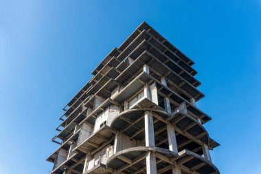 Unfinished Concrete Building Against Blue Sky Construction and Urban Development