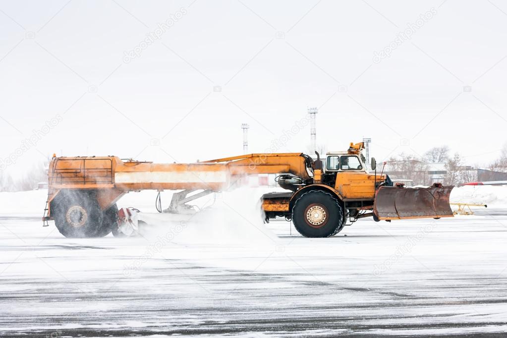 Airfield sweeper cleans the Runway