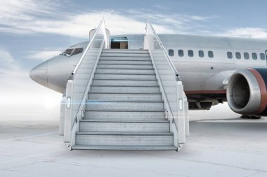 Passenger airplane with a boarding stairs on the airport apron isolated on bright background with sky clipart