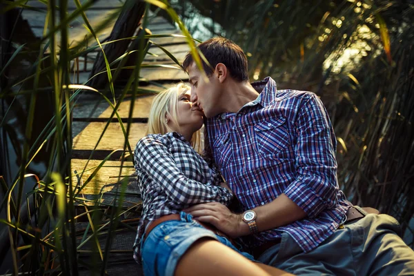 Couple in love enjoying tender moments during sunset