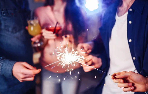 Christmas Sparkles Hands Crowd Young Happy People Sparklers Hands Celebration — Stock Photo, Image