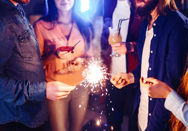 Christmas Sparkles Hands Crowd Young Happy People Sparklers Hands Celebration — Stock Photo, Image