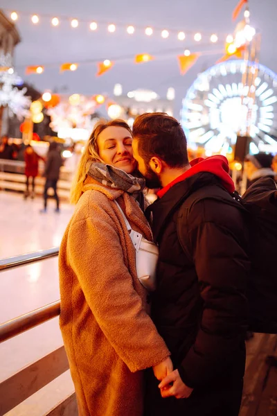 Happy Couple Hugging Kissing Skating Rink Christmas Market Young Woman — Stock Photo, Image