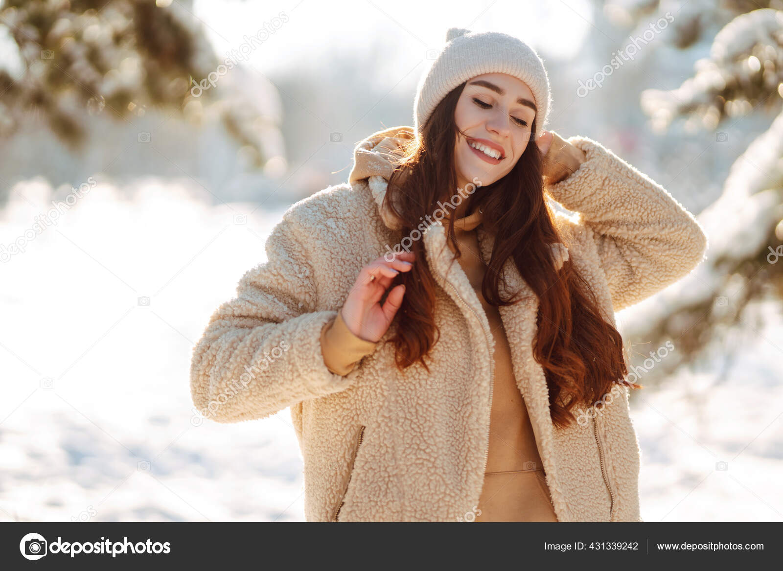 Woman in winter clothes on a walk in the park. There is a lot of
