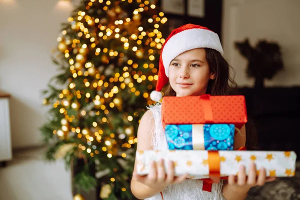 Happy Female Child Santa Red Hat Holding Christmas Gifts Smiling — Stock Photo, Image