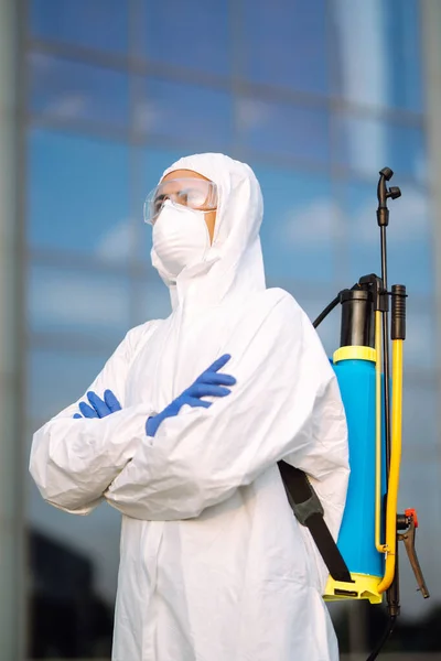 Portrait of Man  in protective hazmat suit and mask. Covid-2019. Prevention of spreading  global pandemic pneumonia virus.