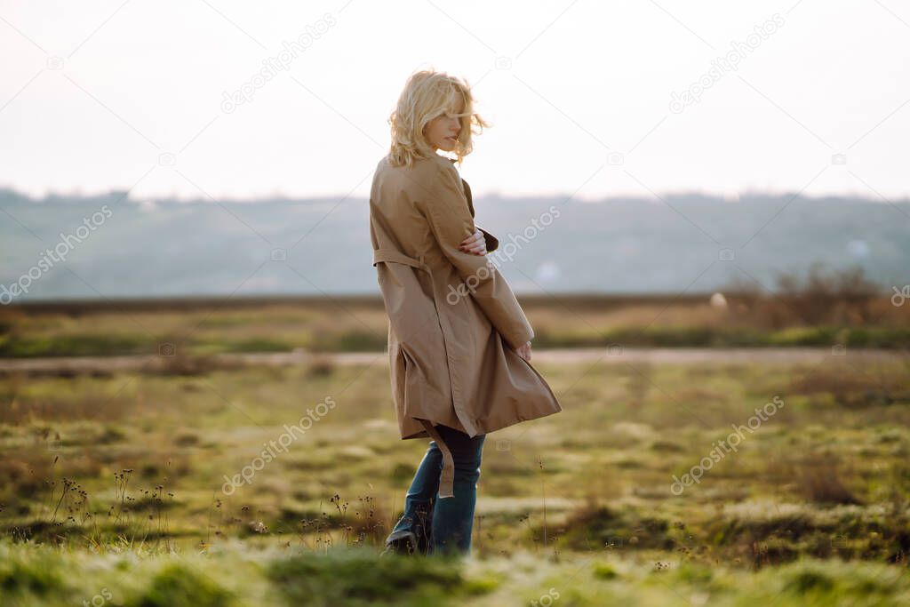 Portrait of beautiful young woman enjoys a spring sunny day. People, lifestyle, travel, nature and vacations concept.