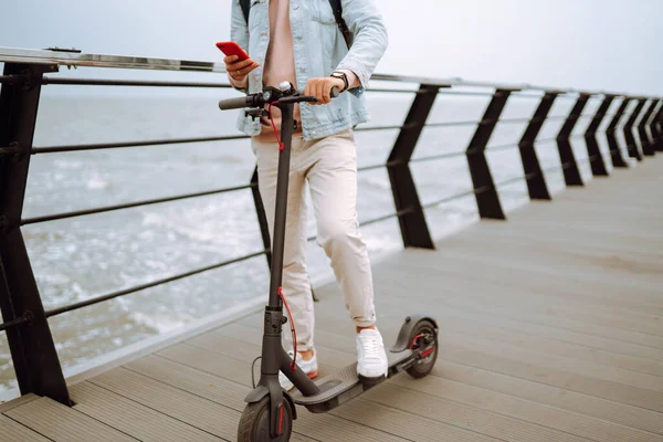 Young Man Phone Riding Electric Scooter Pier Sea Ecological Transportation — Stock Photo, Image
