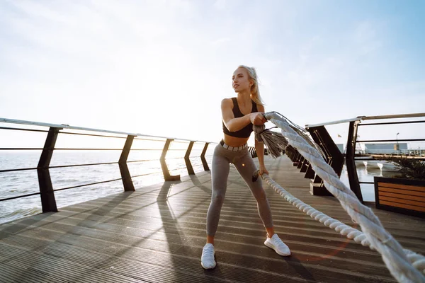 Young Woman Wearing Sports Clothes Doing Exercises Beach Pier Morning — Stock Fotó