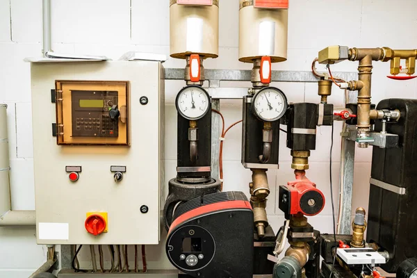 Technical room with devices for controlling the temperature of the water