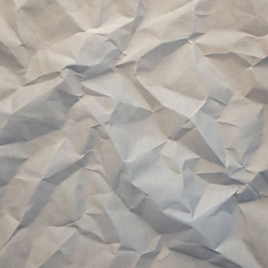 İnce kırışıklıklar ve yumuşak gölge tonlarıyla yumuşak kağıt arkaplan.