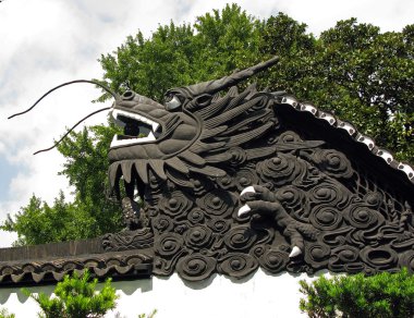 The dragon on the garden wall of the Mandarin Yu clipart