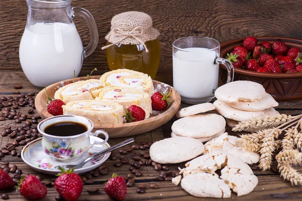 Black coffee on a wooden background with dessert Stock Image