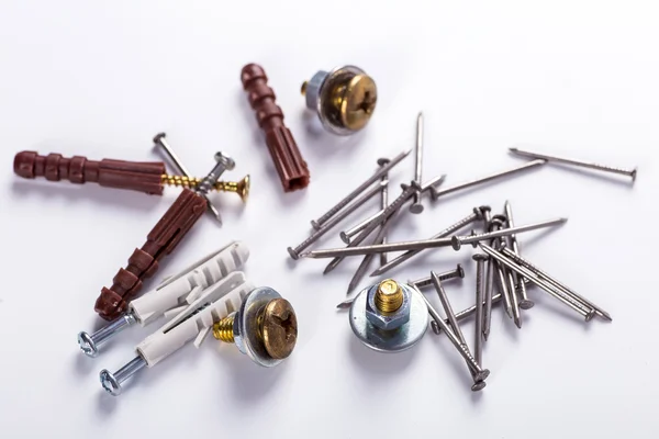 Set of nails nuts and screws on a white background — Stock Photo, Image