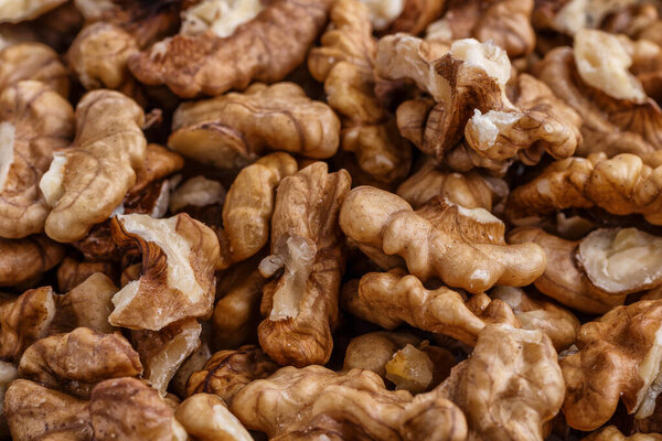 Walnuts shelled. Peeled Raw Walnuts. Fresh organic Nuts. Raw nuts. Many delicious Walnuts as a food background.