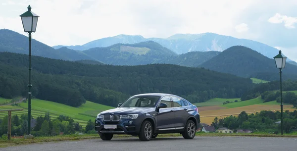 Big car in big mountains — Stock Photo, Image