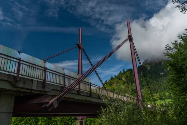 Big bridge over Salzach river in Sankt Johann im Pongau in Austria summer mountains