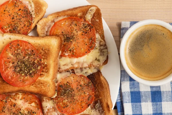 toast with cheese tomato basil oregano and coffee
