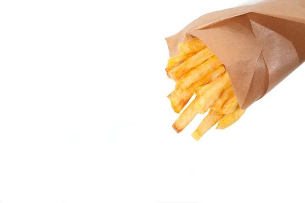 Un sacco di deliziose patatine fritte cotte a casa su uno sfondo bianco — Foto Stock