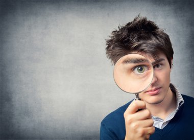 Man with magnifying glass clipart
