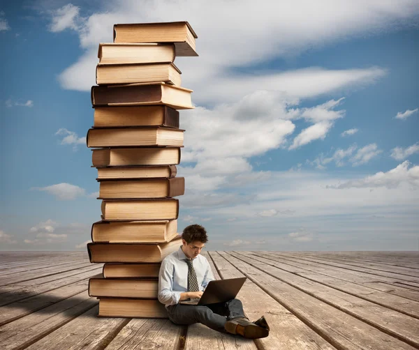 Young man with laptop — Stock Photo, Image