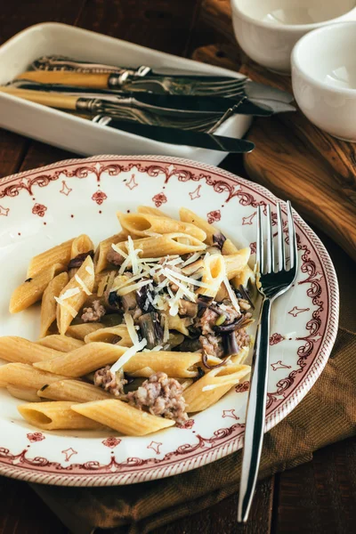 Pasta with sausage and radicchio — Stock Photo, Image