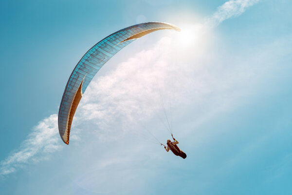 Man Paragliding in sky