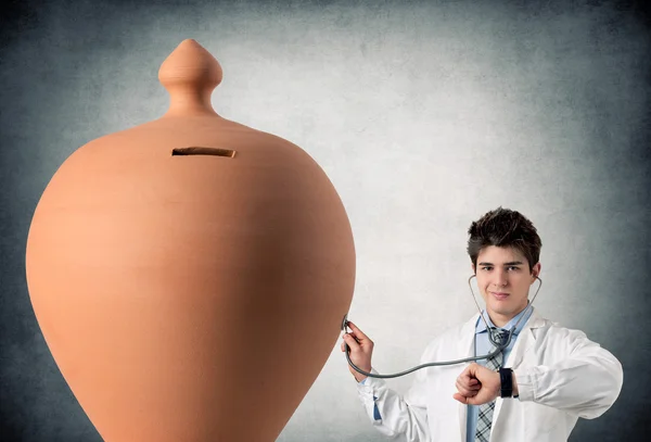 Young Doctor by piggy bank