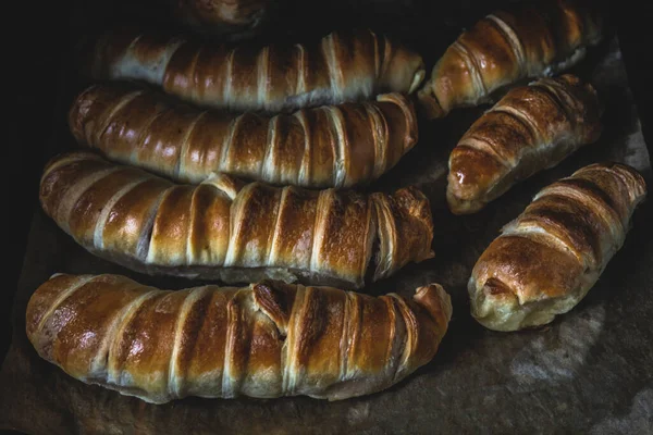 Sausages Dough Baking Sheet Baking Parchment Dark Colors Rustic Style — Stock Photo, Image