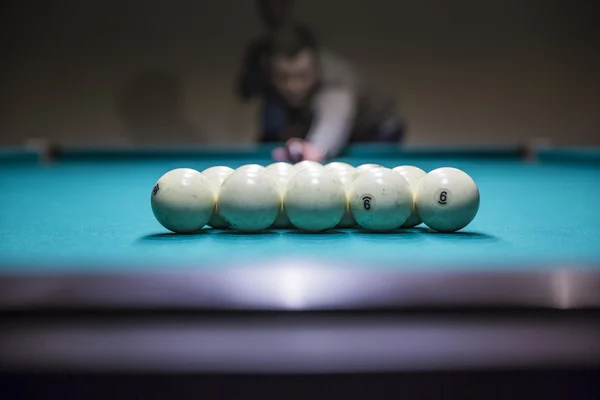 Man in  prepare for start game of billiard balls with triangle — Stock Photo, Image