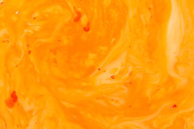 Arka plan olarak kullanmak için akrilik karışımının yakın plan soyut rengi. Mermer desenli akrilik doku, kahverengi ve turuncu mermer arka plan