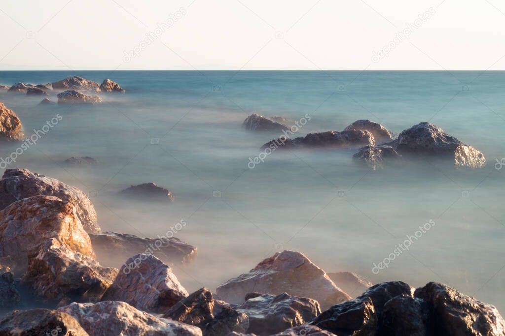 seaside with many rocks, long exposure. long exposure of sea and rocks, Aegean sea Balikesir Turkey