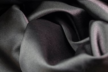 Tasarım için gri kumaş dokusu. Çuval kumaş desenli. Arka plan için tuval. Görüntü yüzeysel alan derinliğine sahip. Siyah tuval dokusu arkaplanı