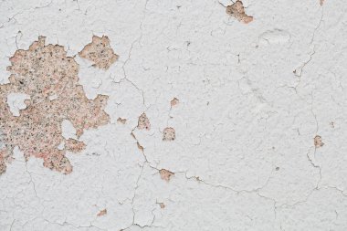 Beyaz boyalı eski duvar dokusu soyulmuş, kapalı desen soyut eski duvar arkaplanı, beton zemin.