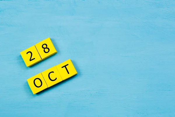 Yellow Cubes Calendar Blue Wooden Surface October Copy Space — Stock Photo, Image