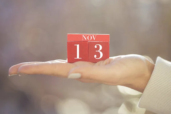 Closeup Female Hand Holding Red Wooden Calendar Red Wooden Cubes — Stock Photo, Image