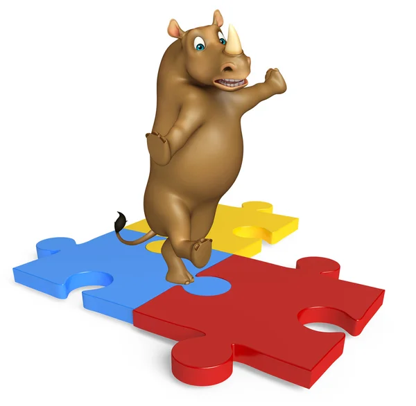 Niedliche Nashorn-Cartoon-Figur mit Puzzle lizenzfreie Stockbilder