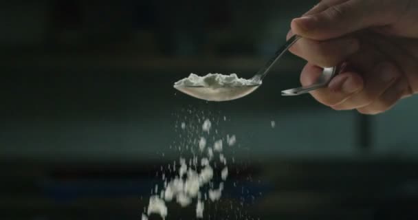 Nice and gently slowmotion spoon of salt in the water — Stock Video
