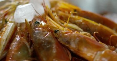 shrimps and fish on professional italian kitchen  in extreme slowmotion