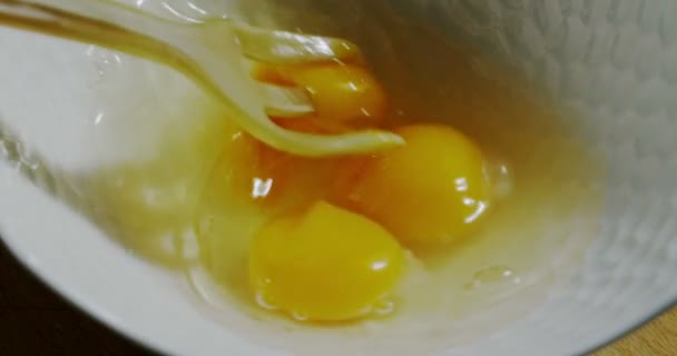 Eggs and fork in extreme slowmotion in italian kitchen — 图库视频影像